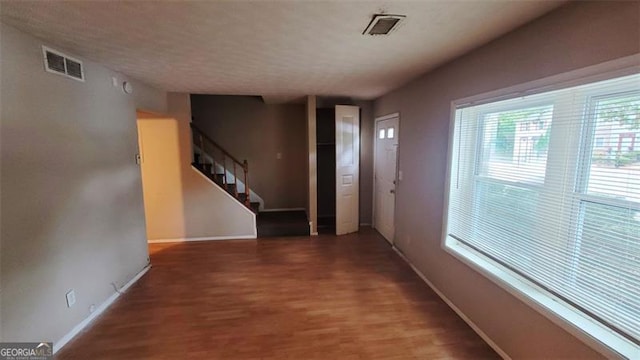 hall with dark hardwood / wood-style flooring