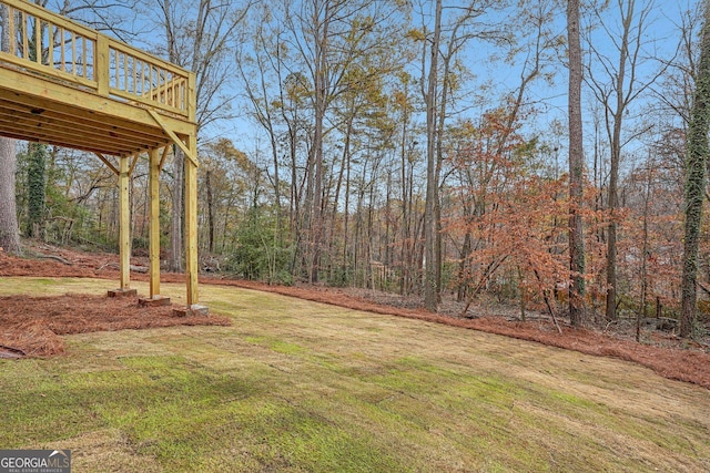 view of yard with a wooden deck