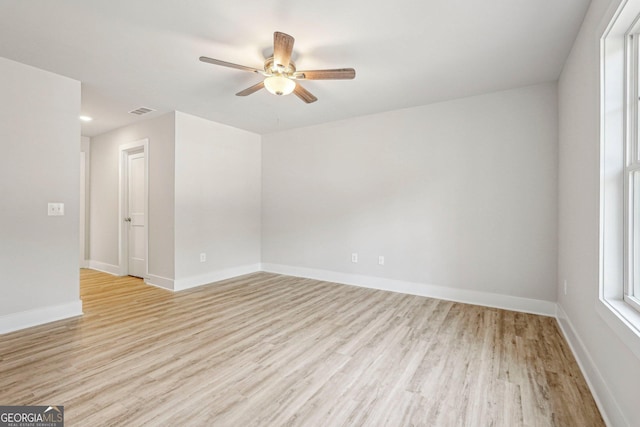 spare room with ceiling fan and light hardwood / wood-style flooring