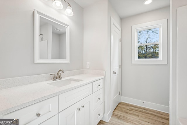 bathroom featuring vanity and hardwood / wood-style floors