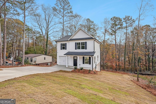 view of front property featuring a front yard and a garage