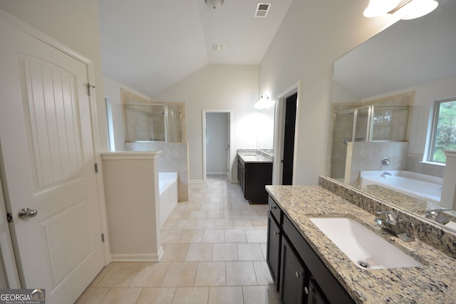 bathroom featuring lofted ceiling, shower with separate bathtub, tile patterned flooring, and vanity