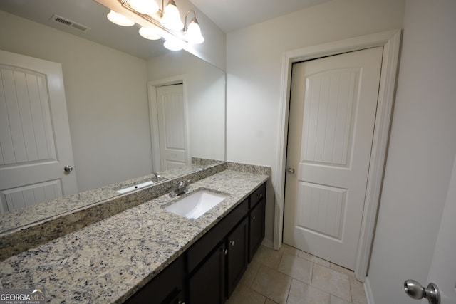 bathroom with vanity and tile patterned floors