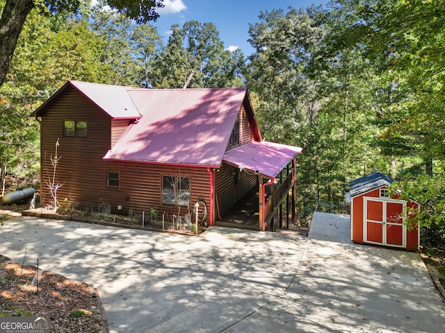 view of home's exterior featuring a storage unit