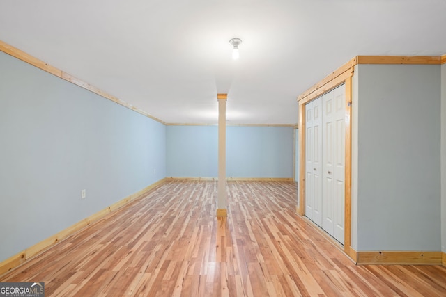 basement featuring light hardwood / wood-style flooring