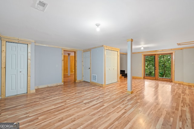 basement with light hardwood / wood-style floors