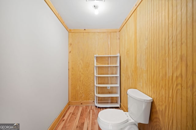 bathroom featuring toilet and hardwood / wood-style floors