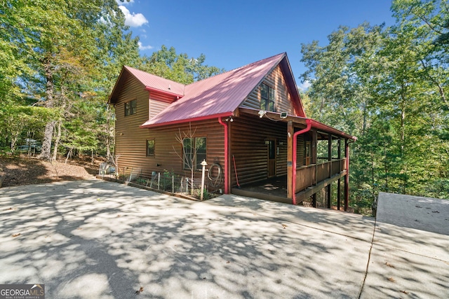 view of property exterior featuring covered porch