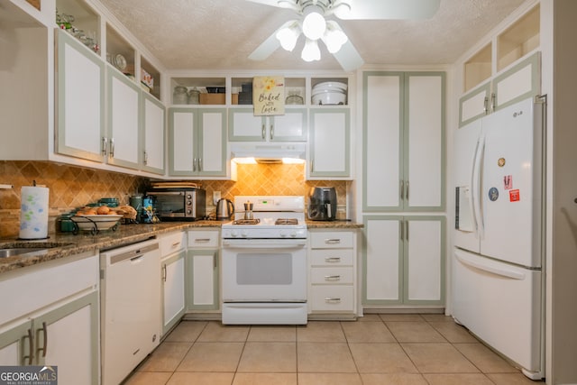 kitchen featuring white appliances, white cabinetry, and light tile patterned floors