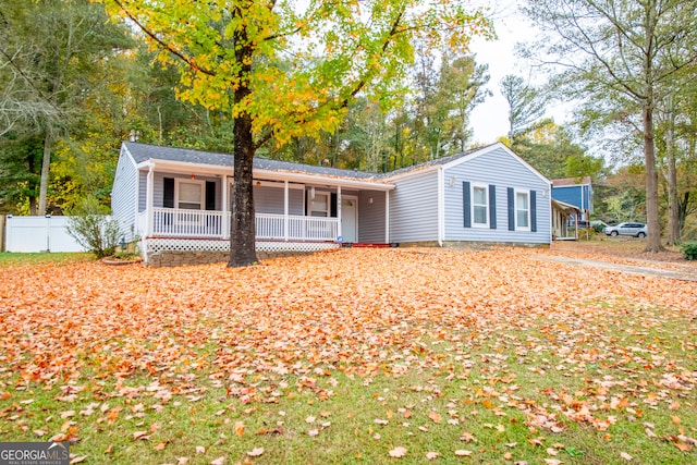 ranch-style home featuring covered porch