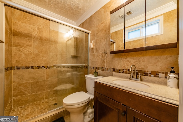 bathroom with crown molding, vanity, a textured ceiling, decorative backsplash, and toilet