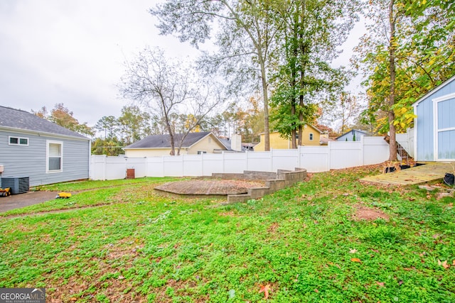 view of yard featuring central AC