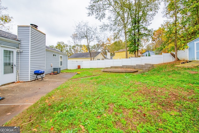 view of yard featuring a patio area and cooling unit