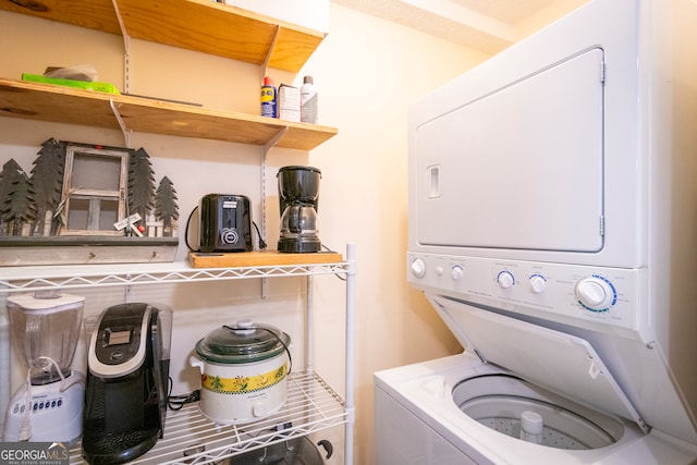 laundry area featuring stacked washer and clothes dryer