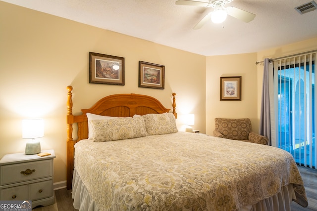 bedroom featuring ceiling fan and dark hardwood / wood-style flooring