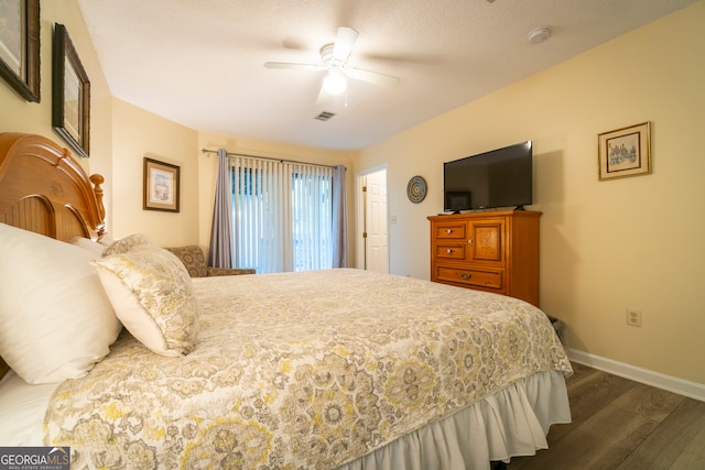 bedroom featuring ceiling fan and dark hardwood / wood-style floors