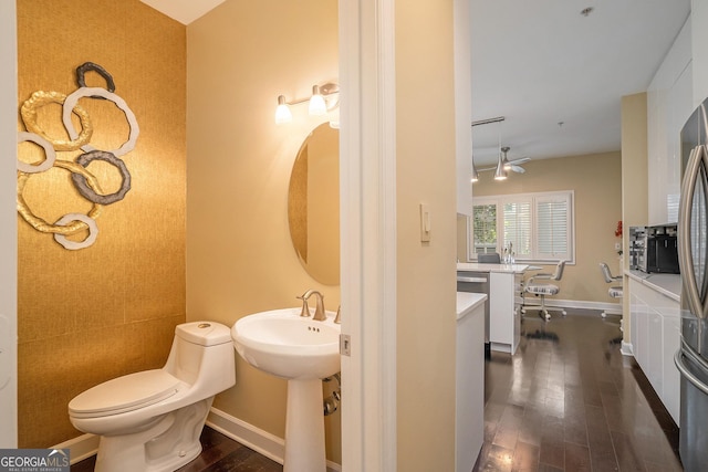 bathroom with wood-type flooring and toilet