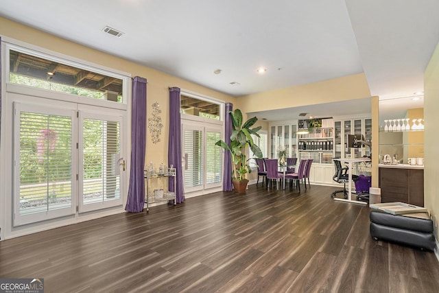 interior space with dark wood-type flooring and french doors