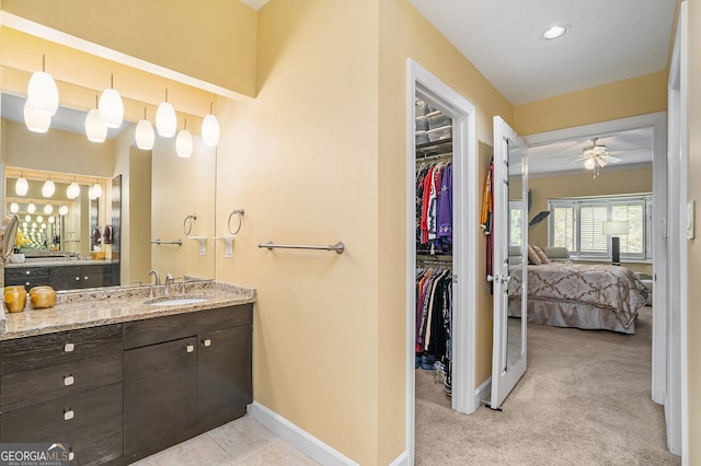 bathroom featuring vanity and ceiling fan