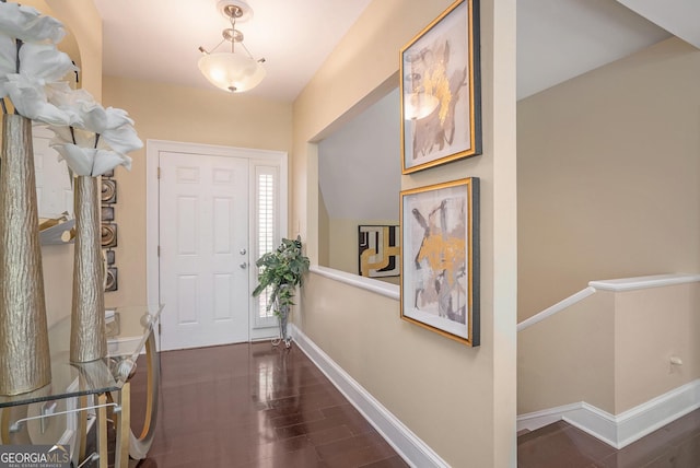 foyer entrance with dark hardwood / wood-style floors