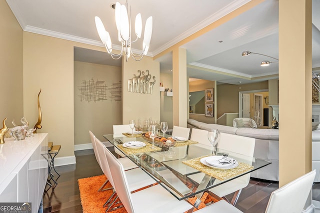 dining area featuring dark hardwood / wood-style flooring, crown molding, and a chandelier