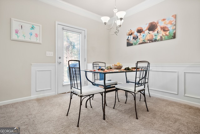 carpeted dining area with crown molding and a chandelier