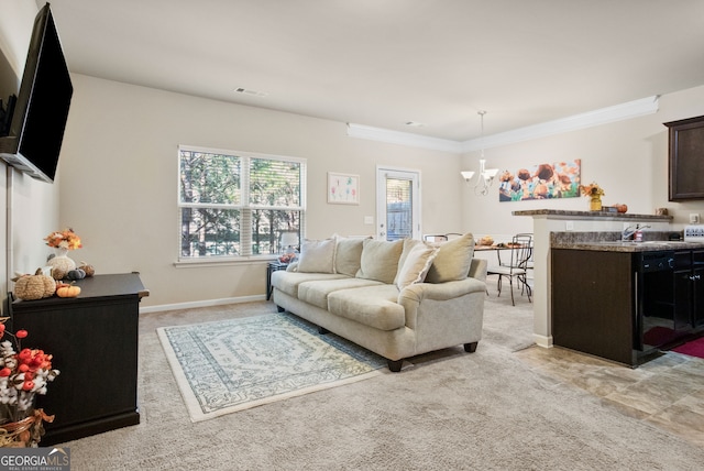 carpeted living room with an inviting chandelier and ornamental molding