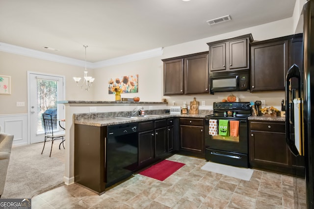 kitchen with a notable chandelier, sink, ornamental molding, and black appliances