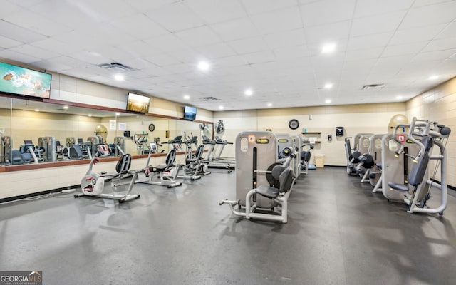 workout area with a paneled ceiling