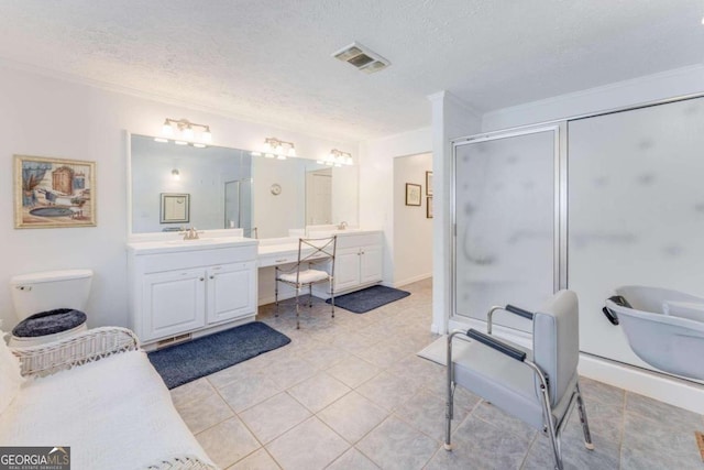 bathroom with tile patterned flooring, plus walk in shower, vanity, and a textured ceiling