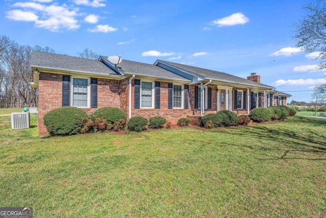 single story home featuring central AC and a front yard