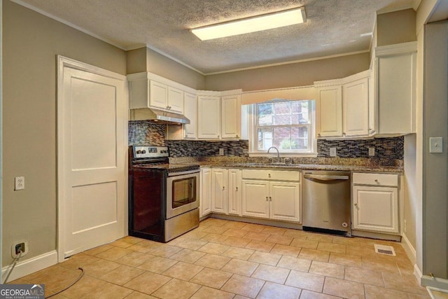 kitchen featuring sink, dark stone countertops, crown molding, white cabinets, and appliances with stainless steel finishes