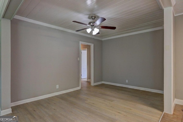 spare room featuring light wood-type flooring, wooden ceiling, ceiling fan, and crown molding