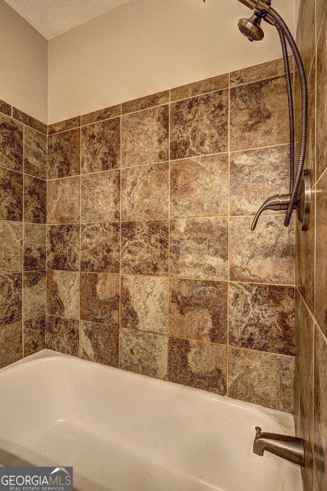 bathroom featuring a textured ceiling