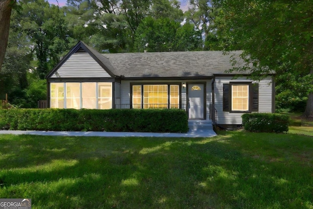 view of front of home with a lawn