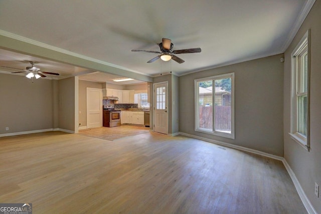 unfurnished living room with light hardwood / wood-style flooring, ceiling fan, and ornamental molding