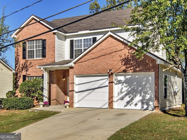 view of property with a front yard and a garage