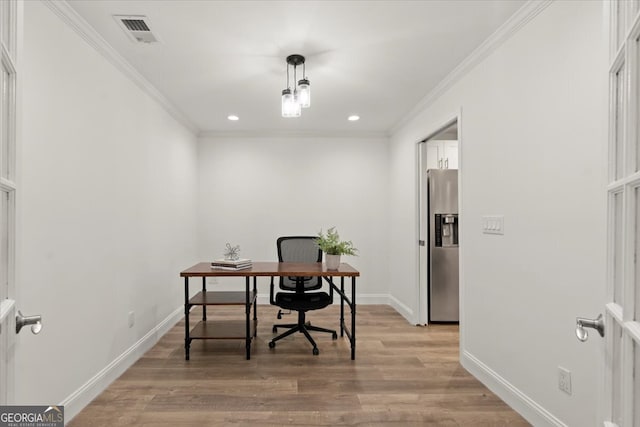 office area with light wood-type flooring and ornamental molding