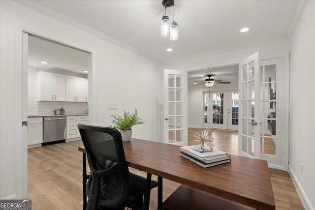 office featuring french doors, light wood-type flooring, crown molding, and ceiling fan