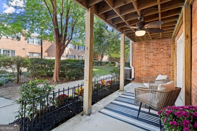 view of patio with central AC unit and ceiling fan