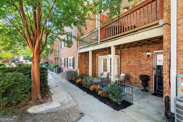 exterior space featuring central AC unit and a balcony