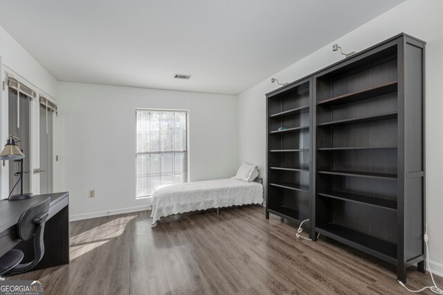 bedroom featuring hardwood / wood-style flooring