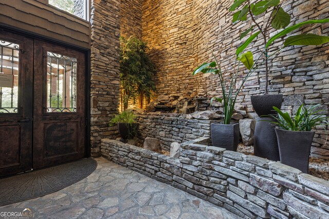 property entrance featuring french doors