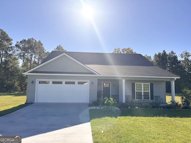 ranch-style home with a garage, a front yard, and covered porch