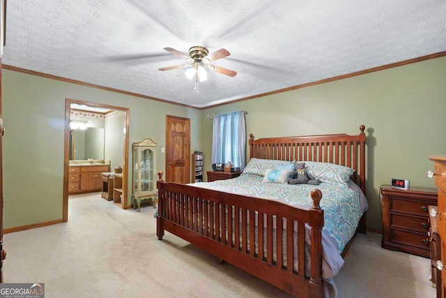 bedroom featuring ceiling fan, ornamental molding, a textured ceiling, light carpet, and ensuite bathroom