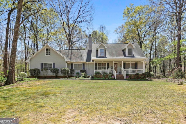 new england style home featuring a front yard and covered porch