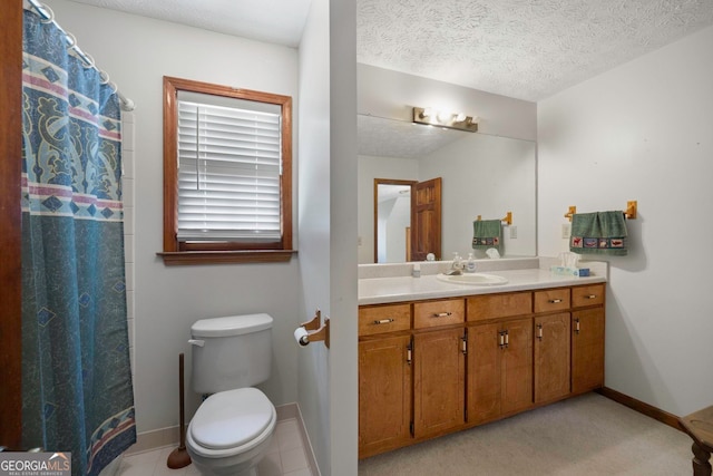 bathroom with vanity, toilet, a shower with shower curtain, and a textured ceiling