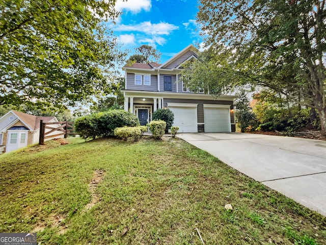 view of front of house with a front lawn and a garage