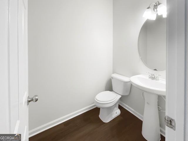 bathroom featuring toilet and hardwood / wood-style floors