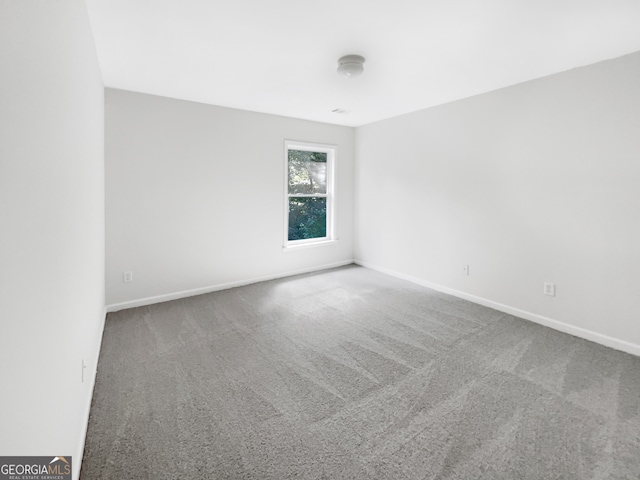 empty room with carpet flooring